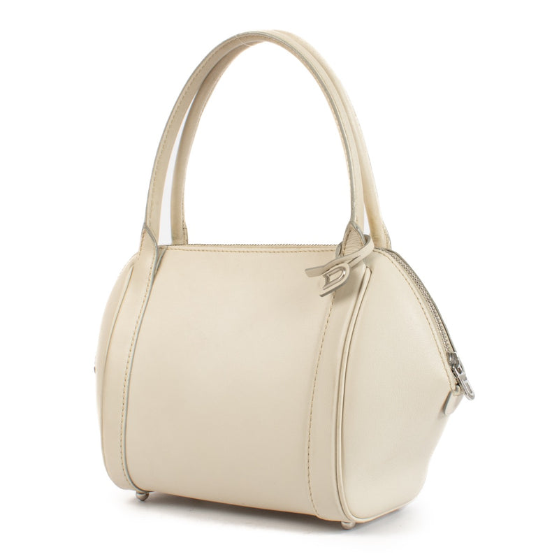 Shop safe online at Labellov in Antwerp and Knokke this 100% authentic second hand Delvaux Cream Mini Perle Top Handle Bag