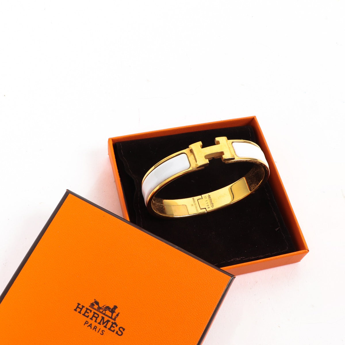 Buy an authentic second-hand Hermès White Enamel Gold-Plated Clic H Bracelet in good condition at Labellov in Antwerp.