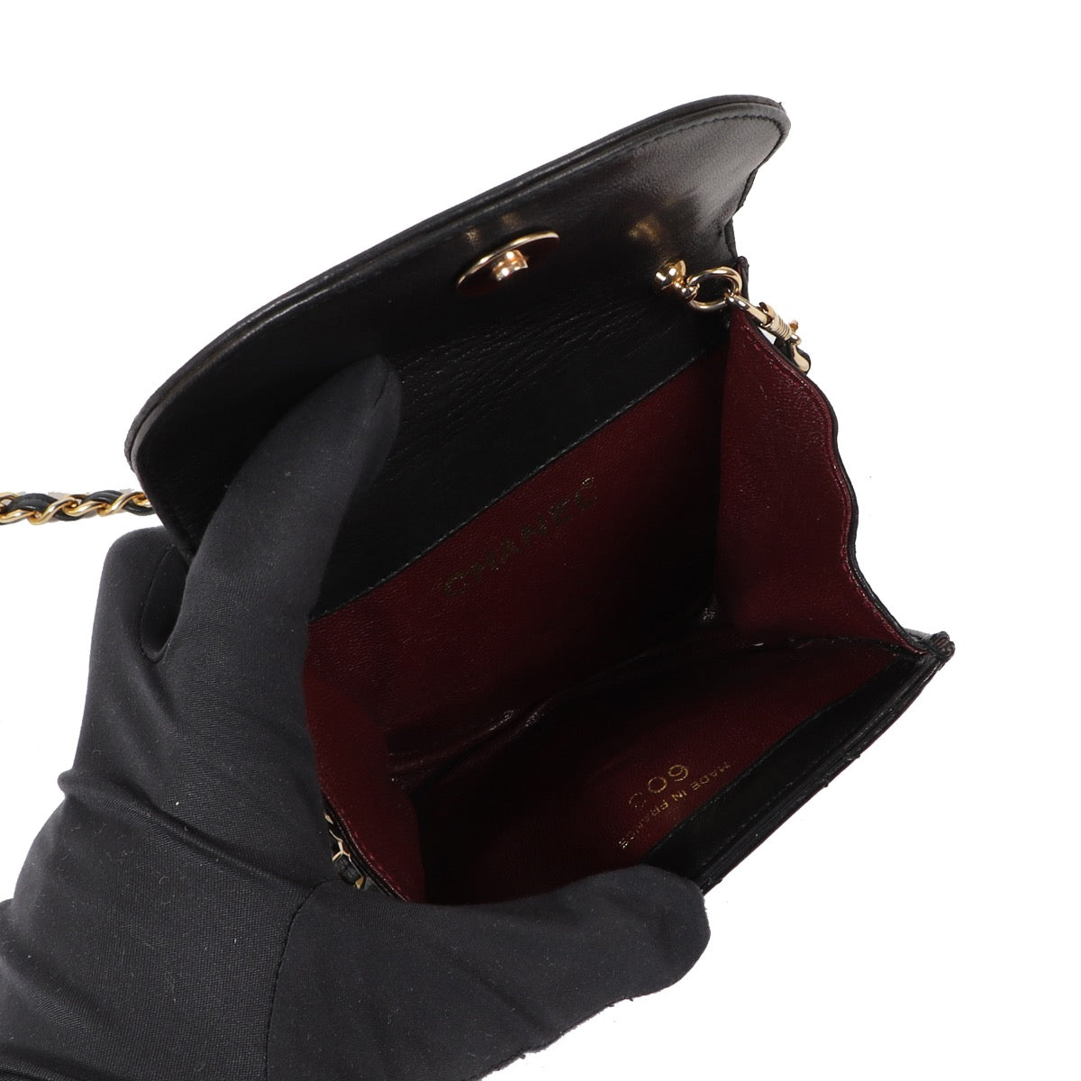 Buy an authentic Chanel Black Lambskin Leather Mini Classic Flap Bag in very good condition at Labellov in Antwerp.