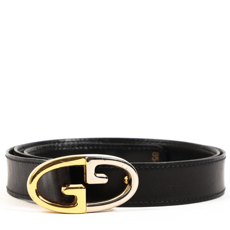Gucci black leather belt with gold and silver buckle detail