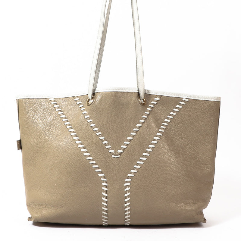 Buy an authentic Yves Saint Laurent White Leather Reversible Tote Bag in preloved condition at Labellov in Antwerp.