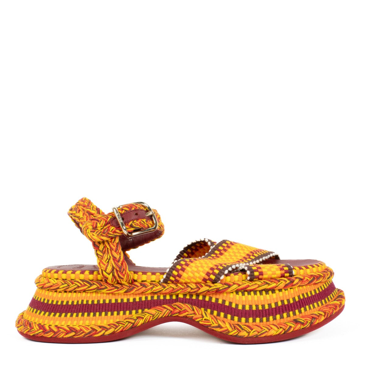 The Chloé Meril sandals in orange feature a handwoven multicolor cotton design with a wavy, chunky platform and adjustable ankle strap. Buy now on Labellov.com.