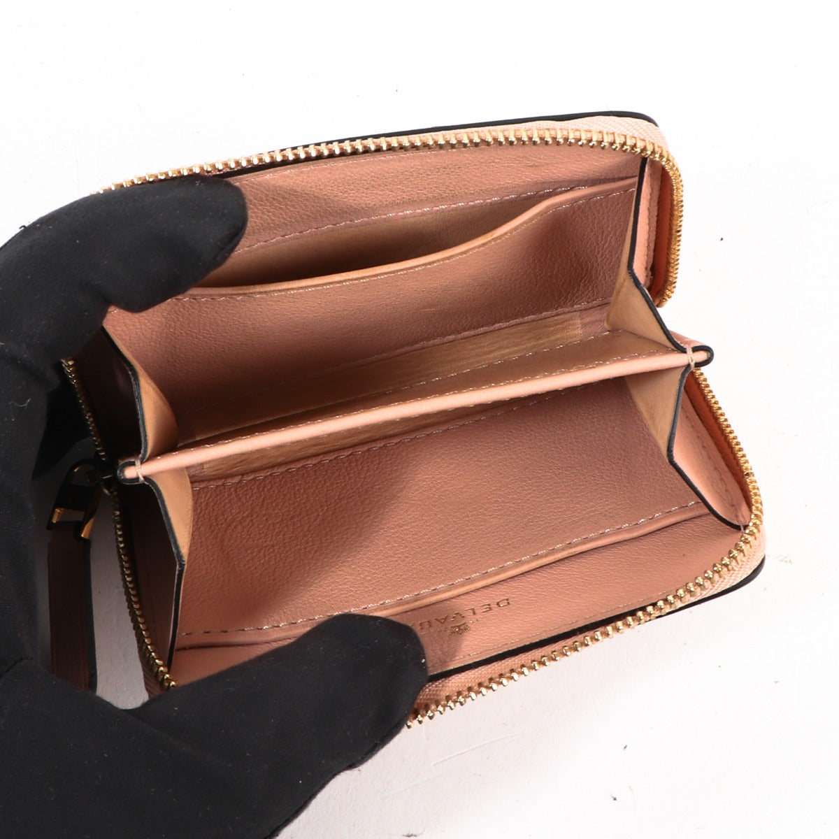Buy an authentic second-hand Delvaux Pink Leather Accordéon PMO Wallet in very good condition at Labellov Antwerp.