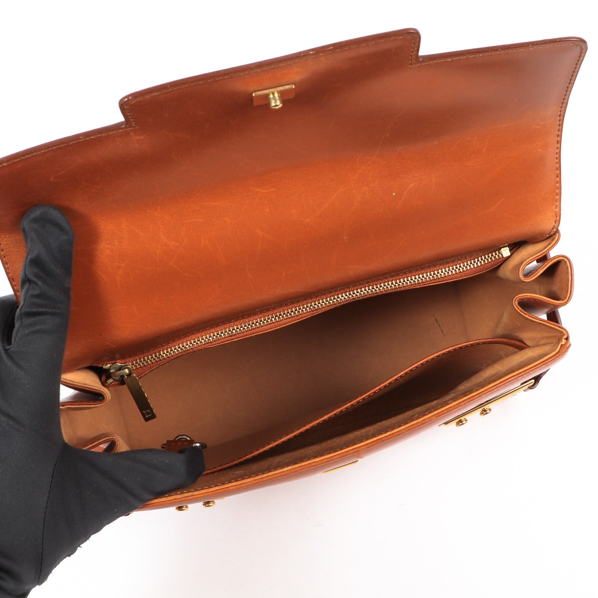 Buy an authentic second-hand Delvaux Cognac Tempête Box Calf Top Handle MM Bag in very good condition at Labellov in Antwerp.