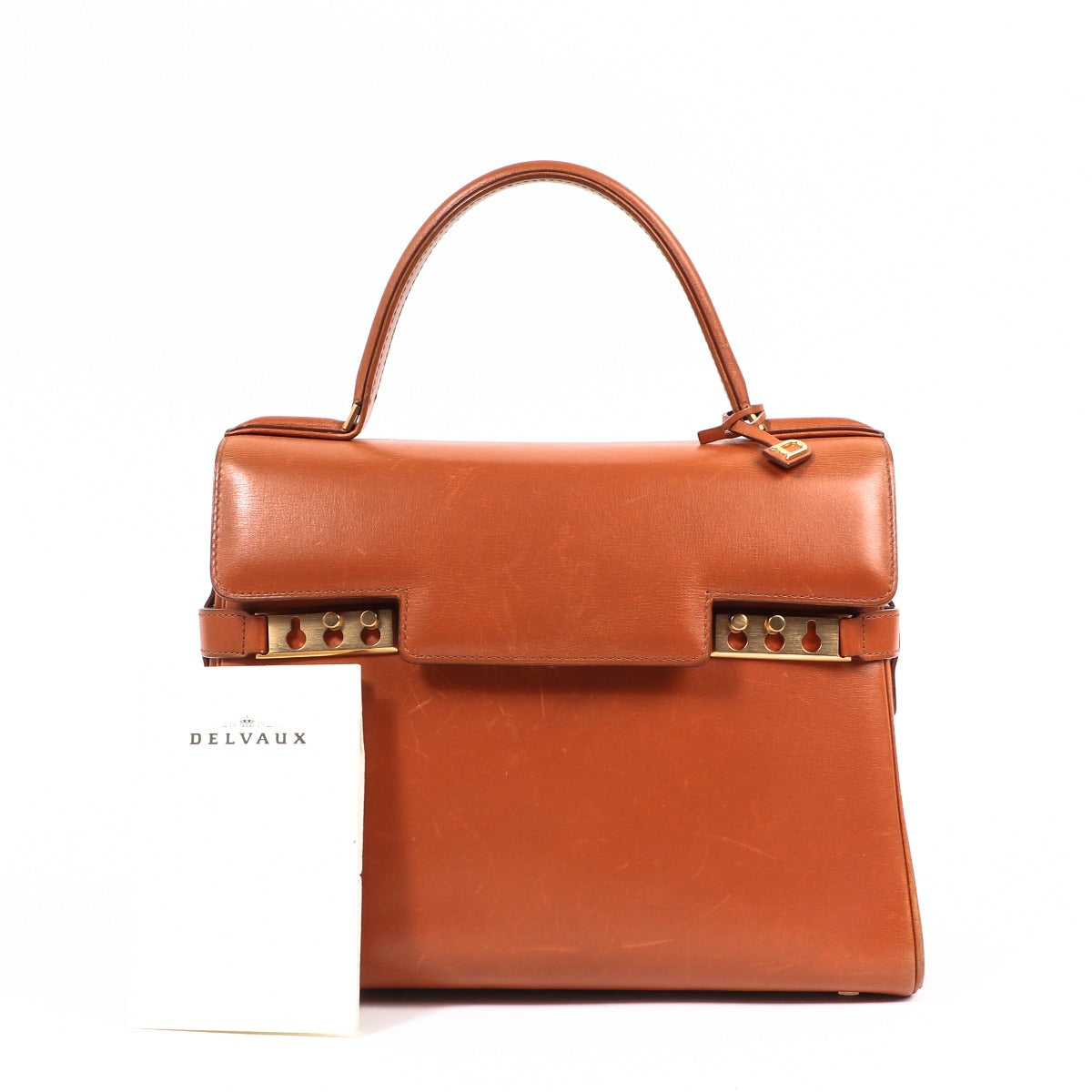 Buy an authentic second-hand Delvaux Cognac Tempête Box Calf Top Handle MM Bag in very good condition at Labellov in Antwerp.