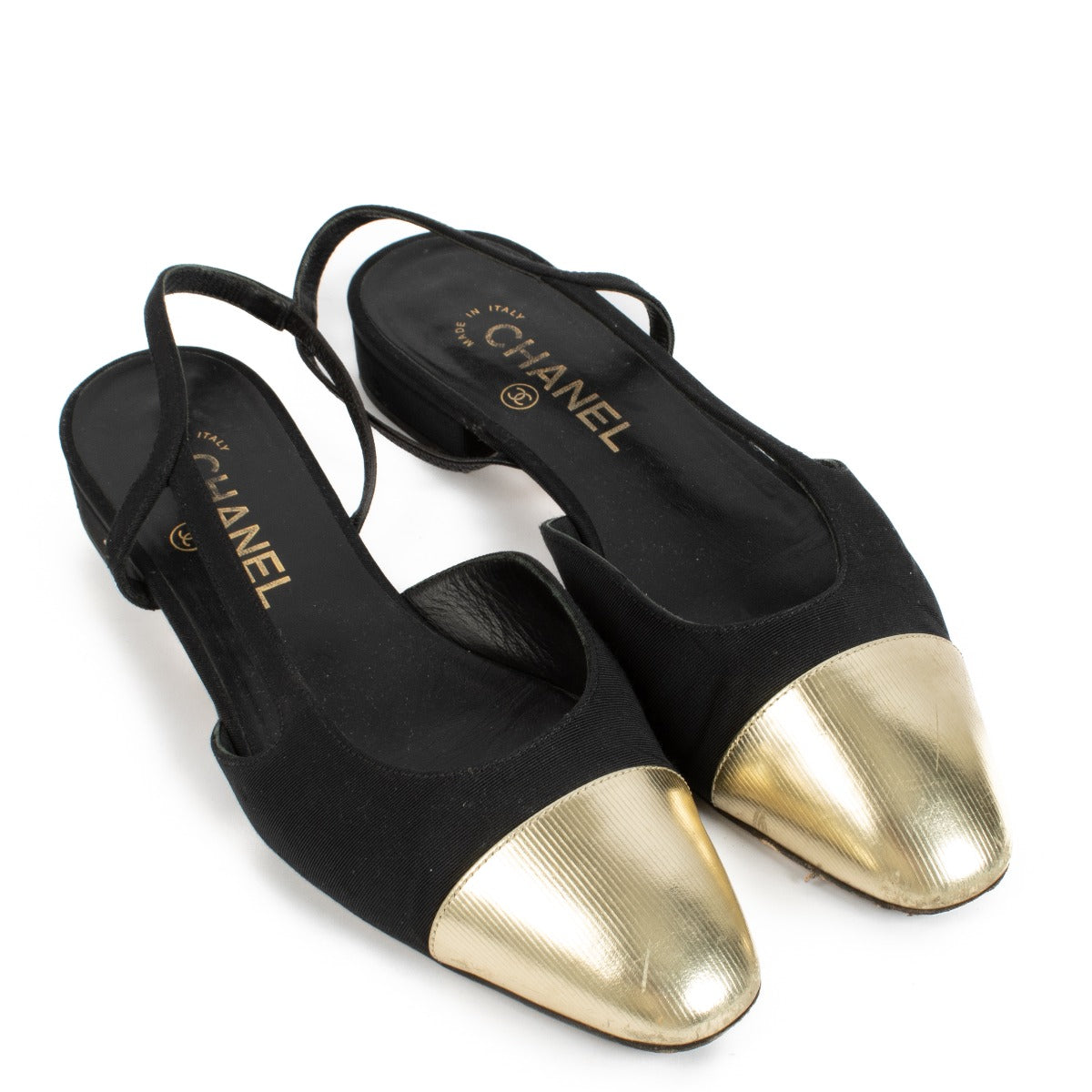 Chanel Gold/Black Slingbacks in size 38, featuring a gold-toned body, classic black toe caps, and an adjustable slingback strap for a chic and versatile look. Shop now on Labellov.com.