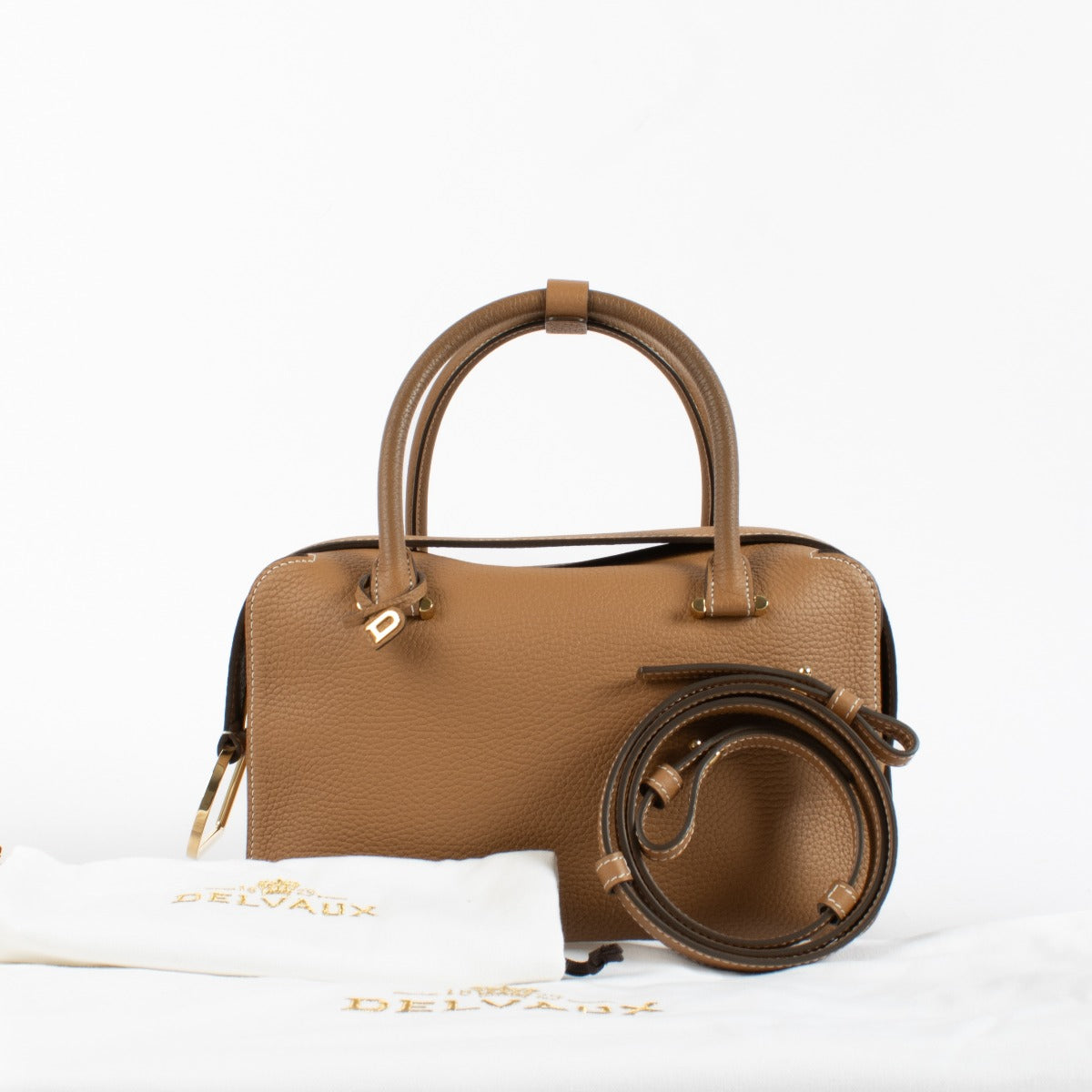 Delvaux Vegetal Cool Box MM brown vegetal leather top handle bag with gold-tone hardware at Labellov.com