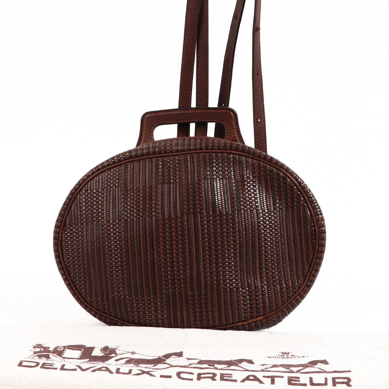 Buy an authentic second-hand Delvaux Brown Toile de Cuir backpack in very good condition at Labellov in Antwerp.