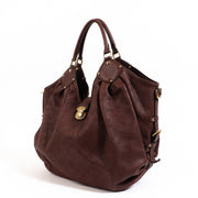 Buy an authentic second-hand Louis Vuitton Brown Mahina Calfskin Shoulder Bag in very good condition at Labellov in Antwerp.