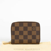 Authentic pre-loved Louis Vuitton Damier Ebene Zippy Coin Purse on Labellov.com