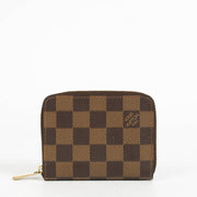Authentic pre-loved Louis Vuitton Damier Ebene Zippy Coin Purse on Labellov.com