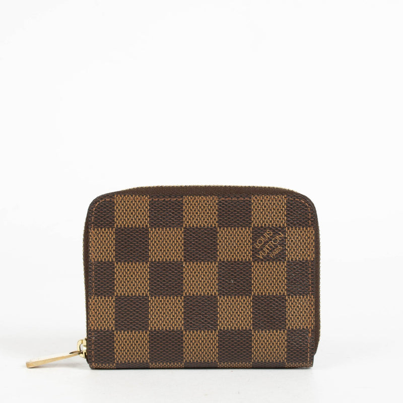 Authentic pre-loved Louis Vuitton Damier Ebene Zippy Coin Purse on Labellov.com