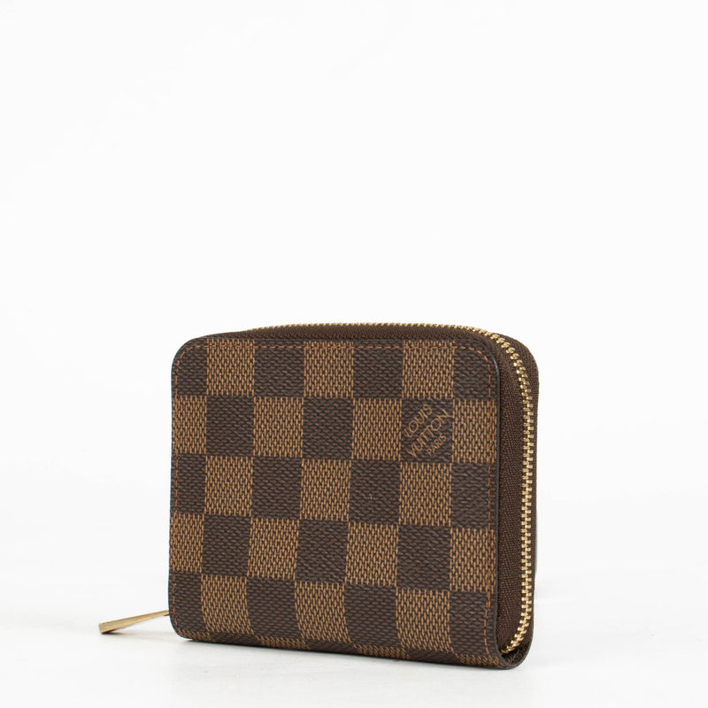 Authentic pre-loved Louis Vuitton Damier Ebene Zippy Coin Purse on Labellov.com