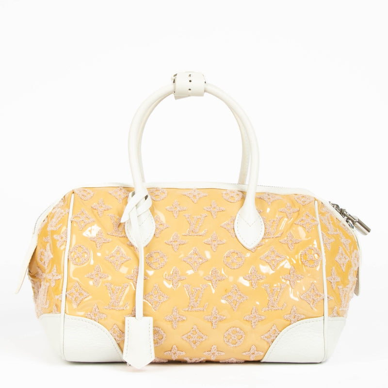 Authentic pre-loved Louis Vuitton Bouclettes Speedy Round Limited Top Handle Bag on Labellov.com