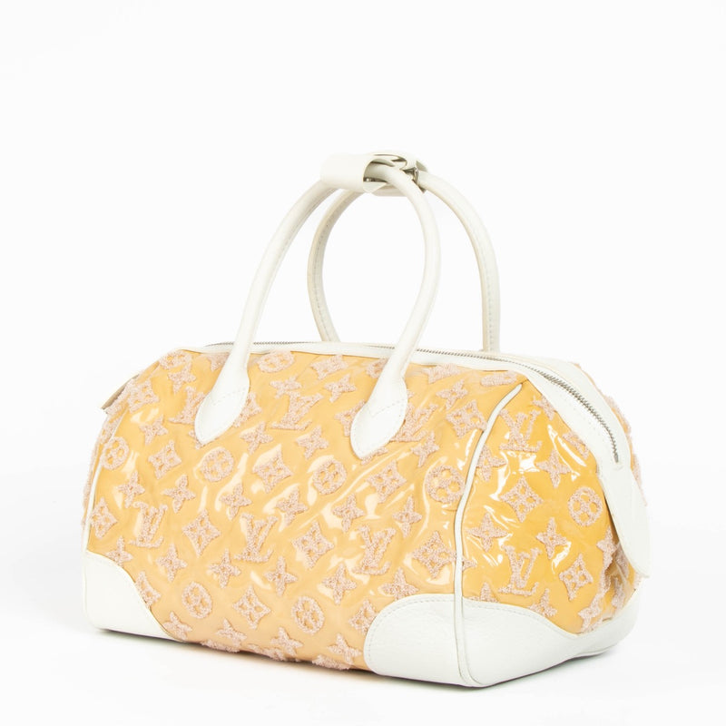 Authentic pre-loved Louis Vuitton Bouclettes Speedy Round Limited Top Handle Bag on Labellov.com