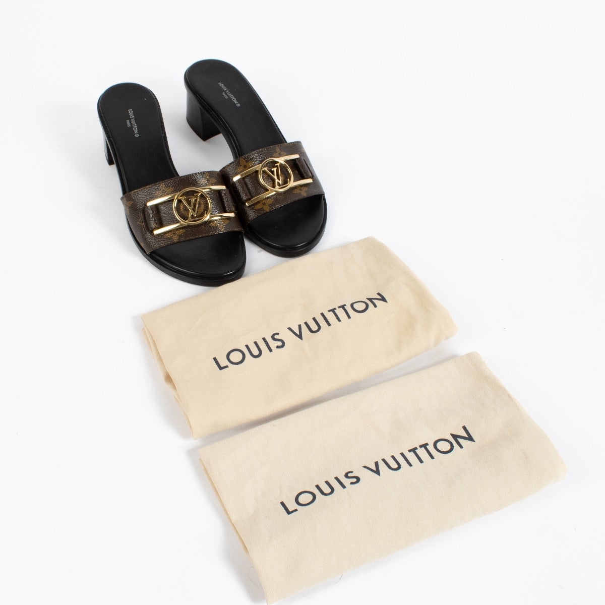 shop 100% authentic second hand Louis Vuitton Monogram Lock It Mule Sandals - Size 39 on Labellov.com