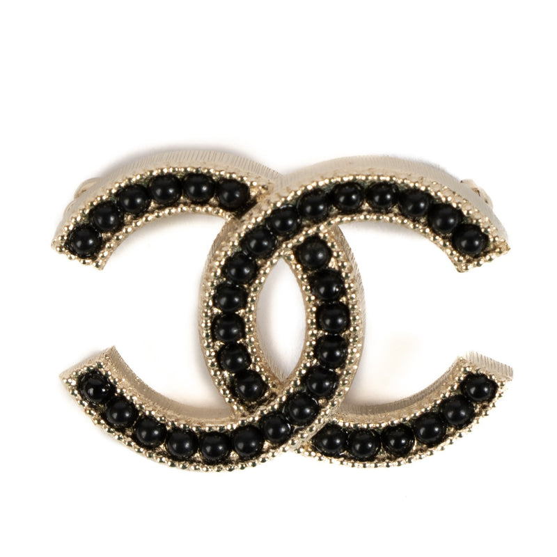 Shop 100% authentic Chanel 16A Gold/Black CC Brooch at Labellov.com.