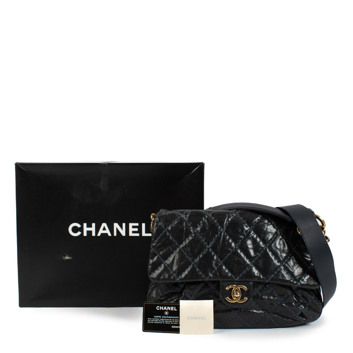 Chanel navy blue calfskin bag with light blue stitching, gold hardware, short shoulder strap, and long crossbody strap. Shop now on Labellov.com.