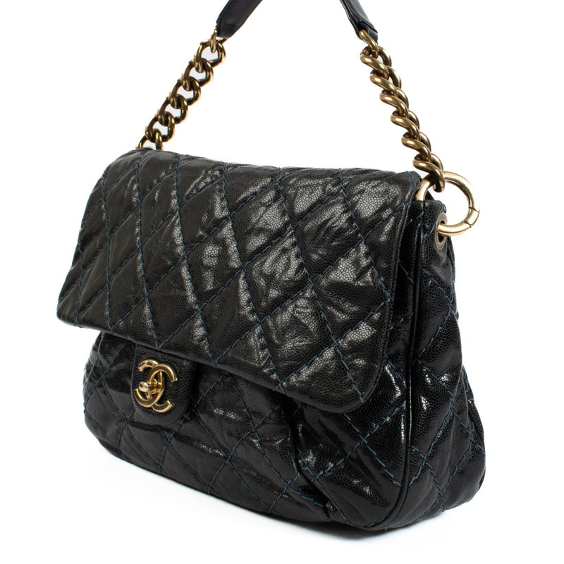 Chanel navy blue calfskin bag with light blue stitching, gold hardware, short shoulder strap, and long crossbody strap. Shop now on Labellov.com.