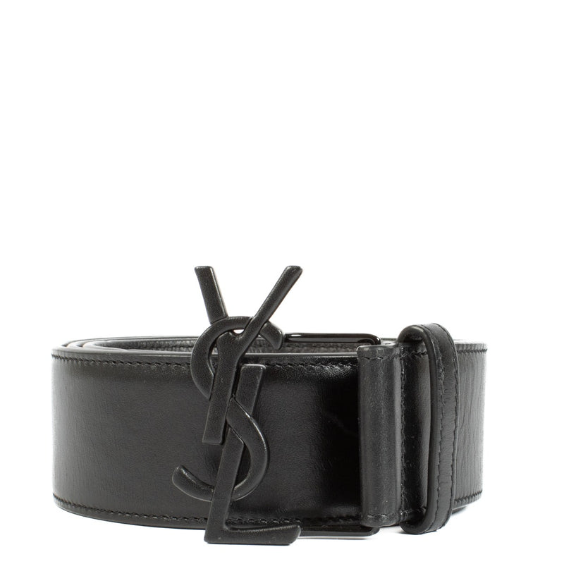 Saint Laurent Black Belt - Size 90, crafted from premium black leather with a black YSL logo buckle. The belt is in very good condition with minimal signs of use, featuring a height of 4 cm. Shop now on Labellov.