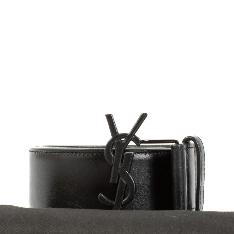 Saint Laurent Black Belt - Size 90, crafted from premium black leather with a black YSL logo buckle. The belt is in very good condition with minimal signs of use, featuring a height of 4 cm. Shop now on Labellov.