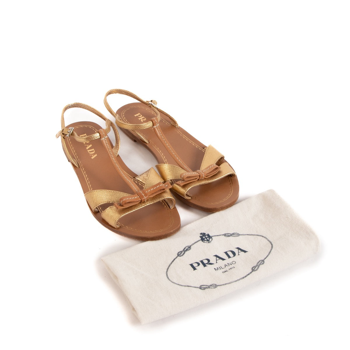 Prada Gold & Tan Leather Bow Sandals - size 36 for the best price at Labellov secondhand luxury in Antwerp. We buy and sell your authentic designer bags online.