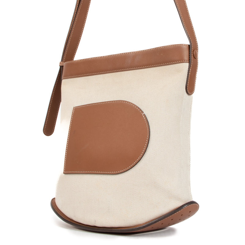 Shop this authentic second hand Delvaux Natural Tan Canvas Pin Daily Bag on Labellov.com