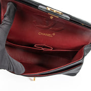 Second hand pre-owned Chanel Black Lambskin Medium Classic Flap Bag on www.labellov.com
