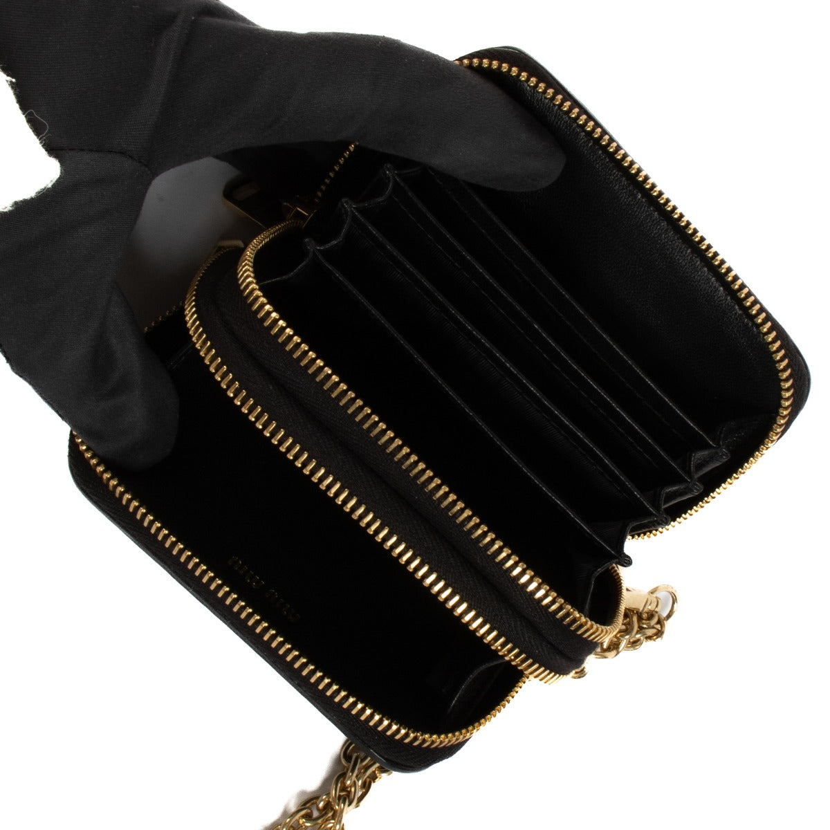 Shop safe online at Labellov in Antwerp, Brussels and Knokke this 100% authentic second hand Miu Miu Black Matelassé Wristlet Wallet