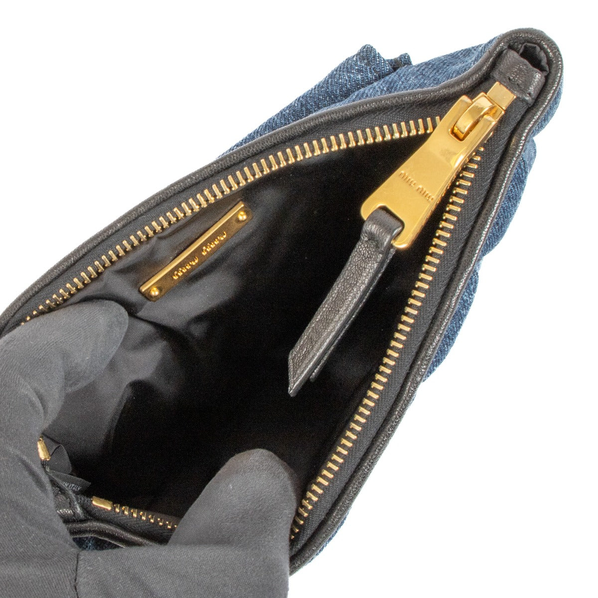Shop safe online at Labellov in Antwerp, Brussels and Knokke this 100% authentic second hand Miu Miu Blue Denim Clutch