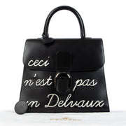 Delvaux Black Brillant GM L'Humour 'Ceci N'est Pas Un Delvaux' Limited Edition for the best price at Labellov secondhand luxury in Antwerp. We buy and sell your authentic designer bags.