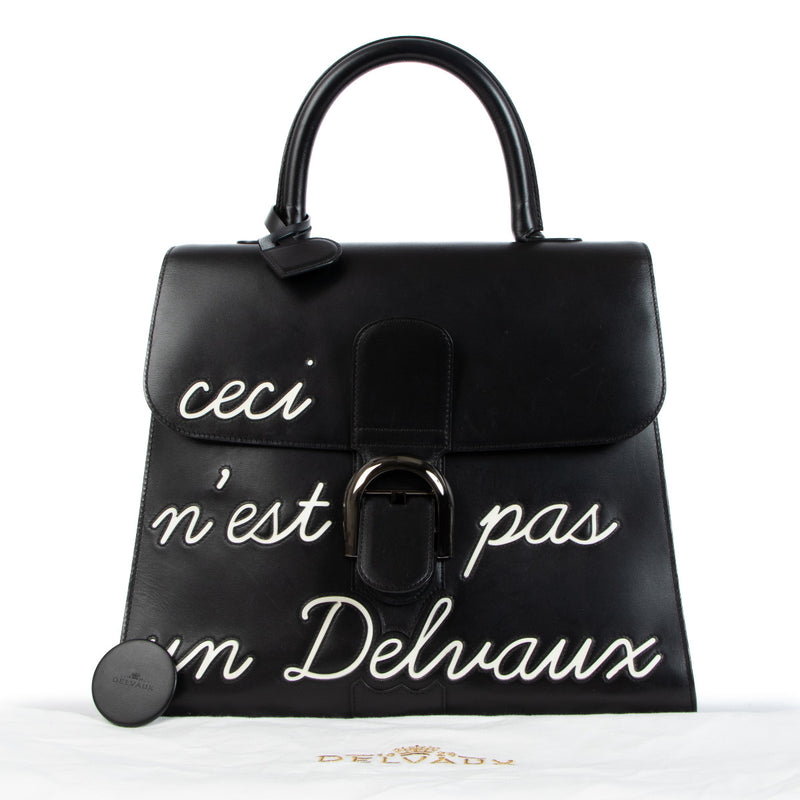 Delvaux Black Brillant GM L'Humour 'Ceci N'est Pas Un Delvaux' Limited Edition for the best price at Labellov secondhand luxury in Antwerp. We buy and sell your authentic designer bags.