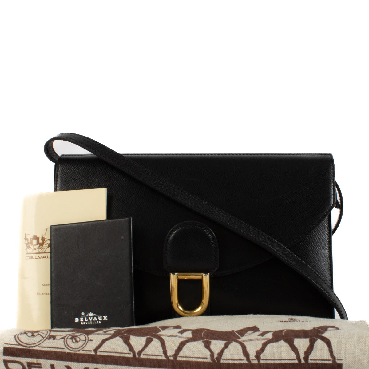 Shop safe online at Labellov in Antwerp, Brussels and Knokke this 100% authentic second hand Delvaux Black Leather Crossbody Clutch Bag