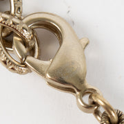 Shop the authentic Chanel Pearl Bracelet with crystal CC charm in champagne-gold hardware at Labellov.com.