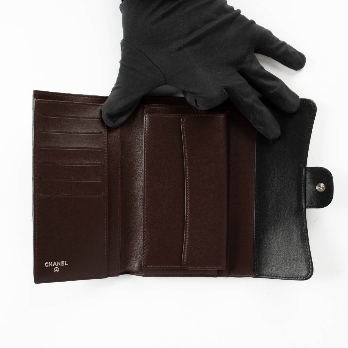 Authentic pre-loved Chanel Black Lambskin Medium Classic Flap Wallet on Labellov.com