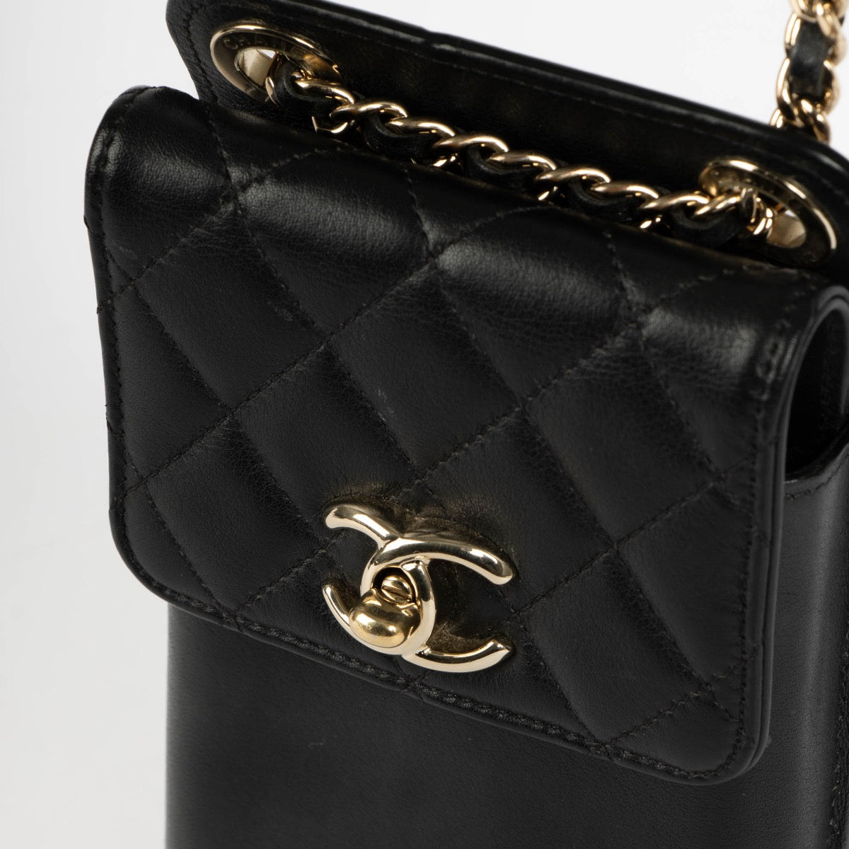 Authentic pre-loved Chanel Black Lambskin Phone Pouch Crossbody Bag on Labellov.com