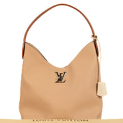 Shop safe online at Labellov in Antwerp, Brussels and Knokke this 100% authentic second hand Louis Vuitton Beige LockMe Hobo Bag