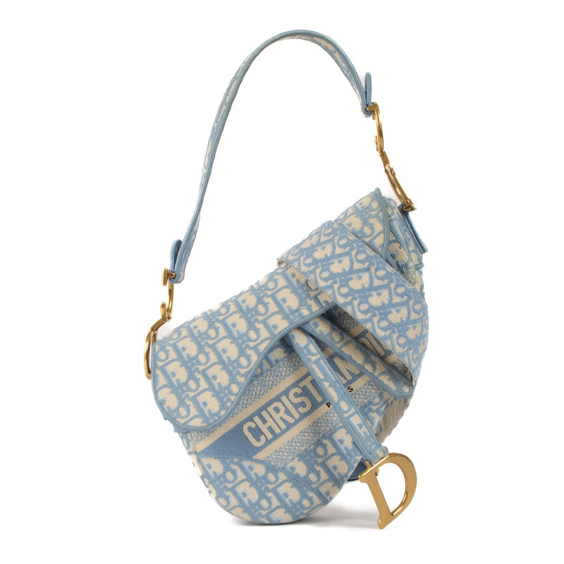 Shop safe online at Labellov in Antwerp, Brussels and Knokke this 100% authentic second hand Christian Dior Cornflower Blue Oblique Saddle Bag + Strap