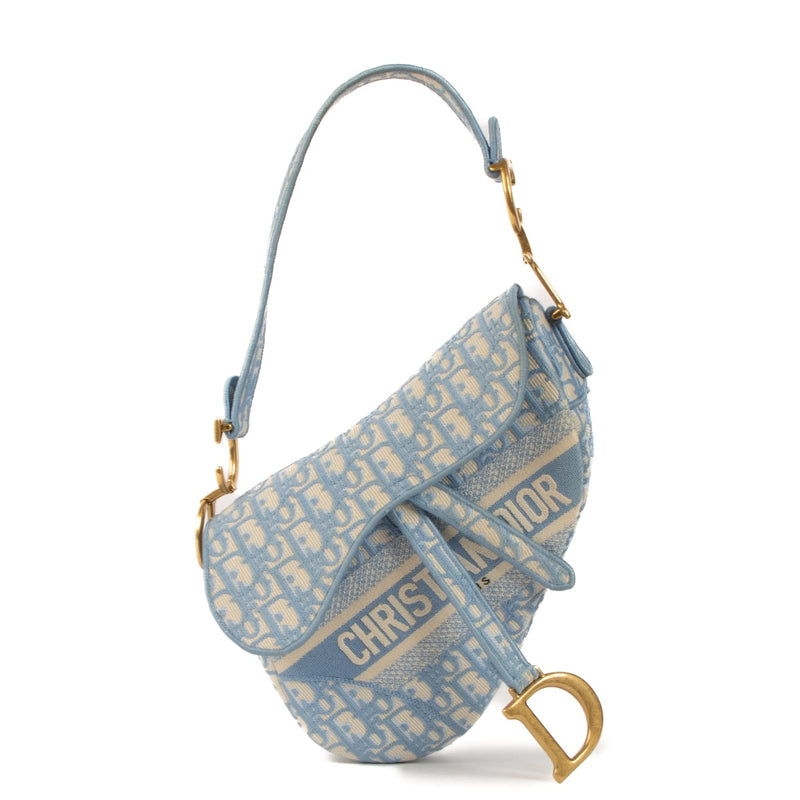 Shop safe online at Labellov in Antwerp, Brussels and Knokke this 100% authentic second hand Christian Dior Cornflower Blue Oblique Saddle Bag + Strap