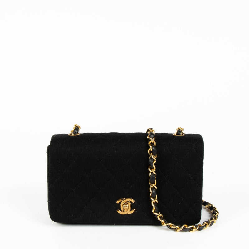 Shop this authentic Chanel Black/Jersey Leather Mini Flap Bag pre-loved on Labellov.com