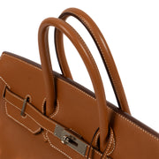 Elevate your style with the iconic Hermès Birkin 35 in Swift Gold - a symbol of sophistication and refinement.