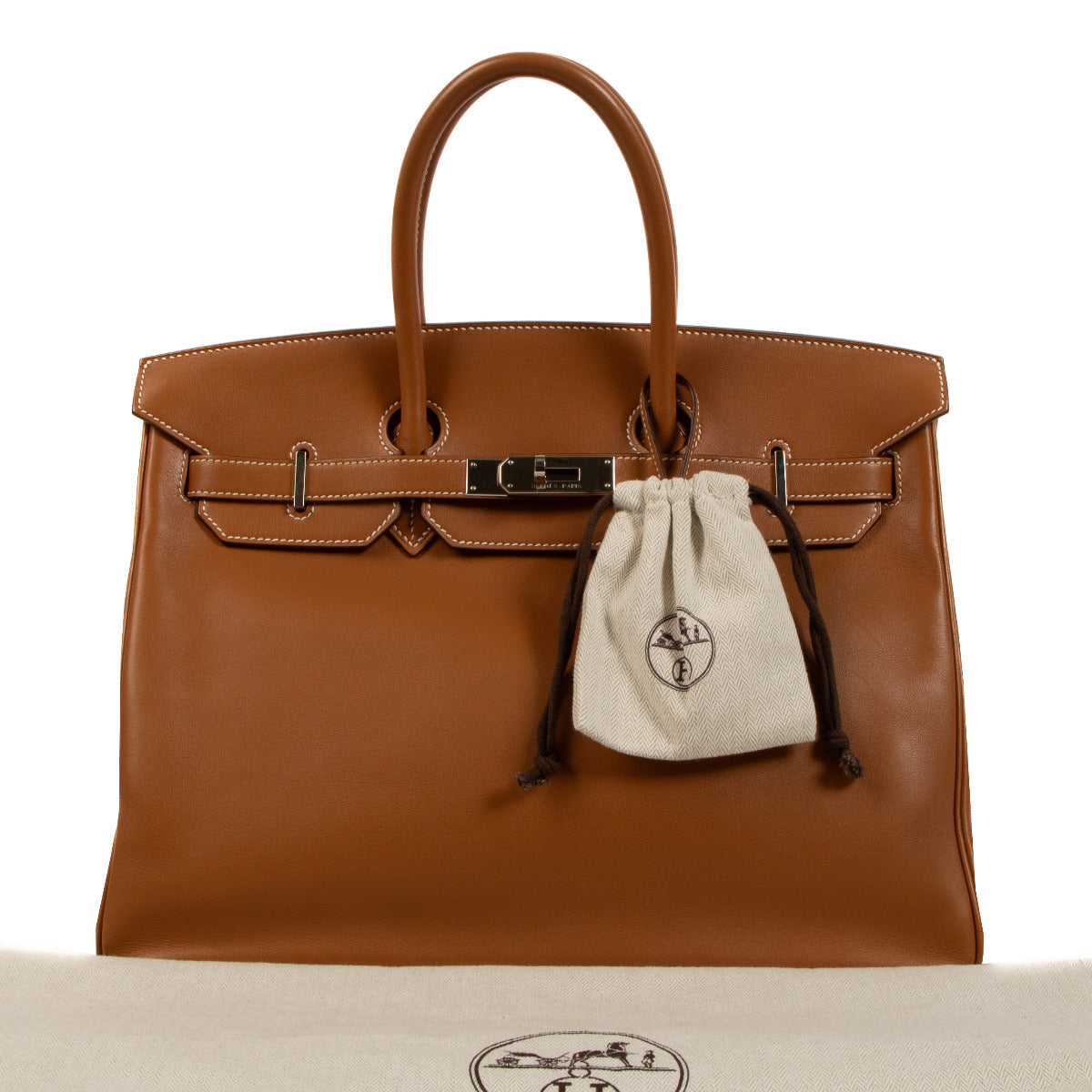 Make a lasting impression with the Hermès Birkin 35 - a prestigious handbag in a dazzling Gold hue with Palladium Hardware available at Labellov secondhand luxury.