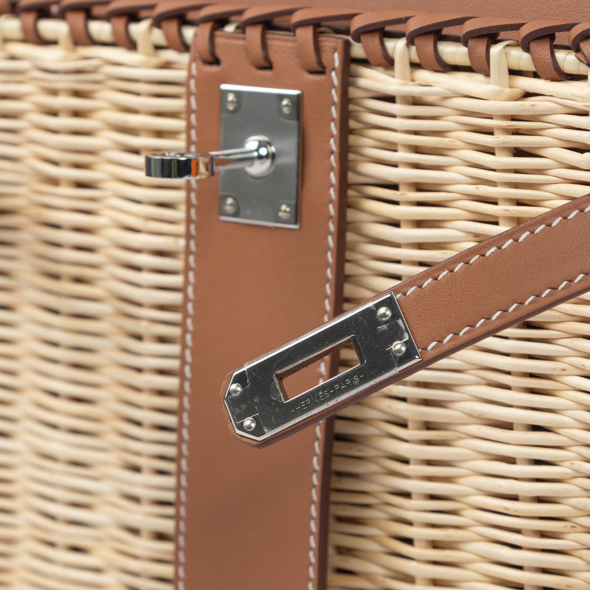 The Kelly Mini Picnic boasts a secure turn-lock closure and a well-organized interior that can accommodate your essentials, ensuring that you're not just making a fashion statement but also enjoying everyday convenience.