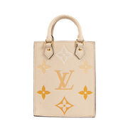The neutral beige tone is elegantly complemented by the subtle hint of sunrise-inspired hues, creating a captivating visual appeal. The bag's exterior is crafted from durable and supple leather, ensuring longevity and a luxurious feel. With its compact