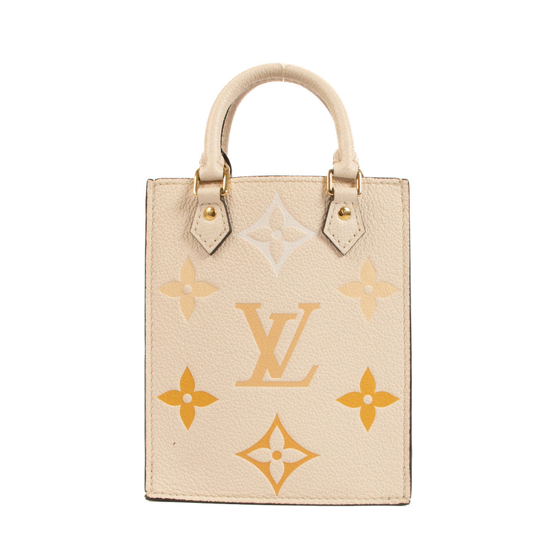 The neutral beige tone is elegantly complemented by the subtle hint of sunrise-inspired hues, creating a captivating visual appeal. The bag's exterior is crafted from durable and supple leather, ensuring longevity and a luxurious feel. With its compact