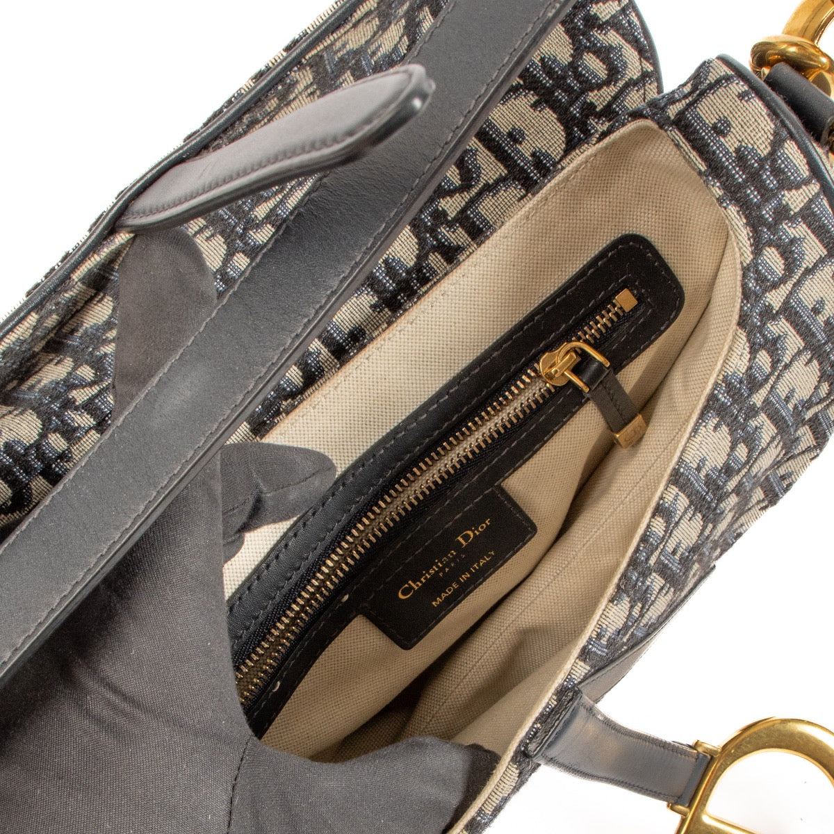 Shop safe online at Labellov in Antwerp, Brussels and Knokke this 100% authentic second hand Christian Dior Blue Oblique-jacquard Saddle Bag + Strap