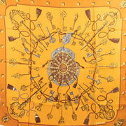 Shop safe online at Labellov in Antwerp, Brussels and knokke this 100% authentic second hand Hermès Ochre Yellow Les Clés Silk Carré 90 Scarf