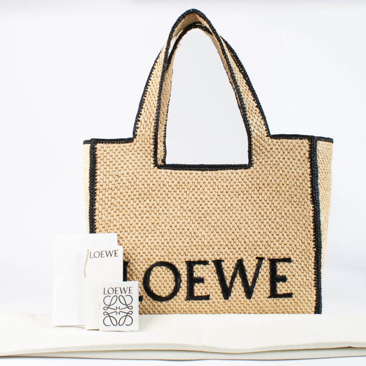 Authentic pre-loved Loewe Large Raffia Font Tote on Labellov.com
