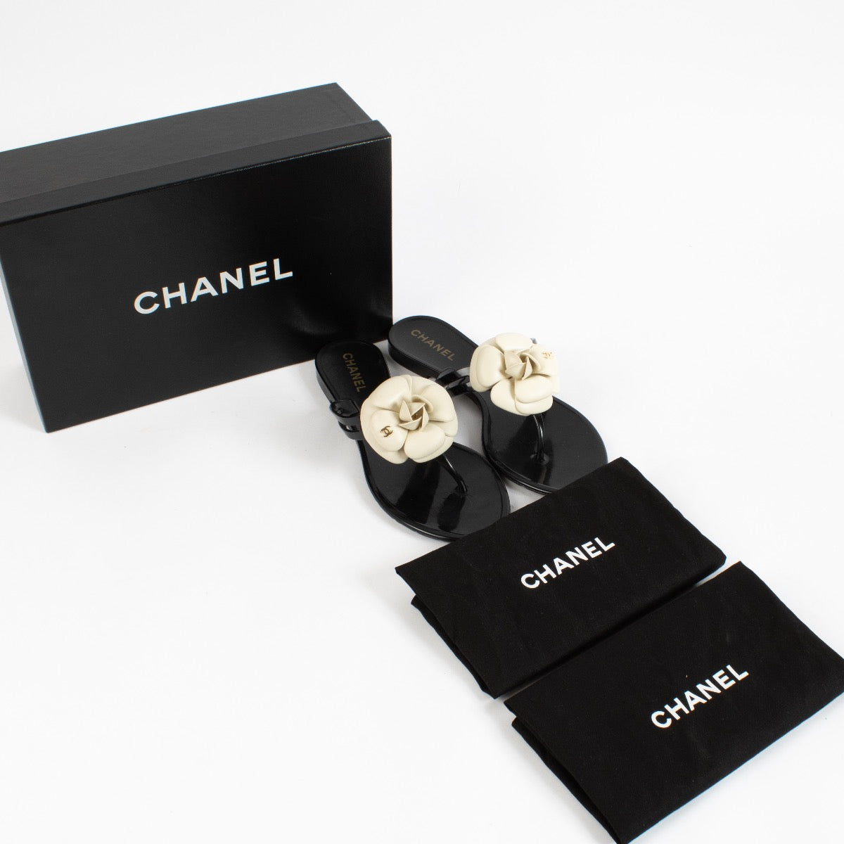 shop 100% authentic second hand Chanel Black Camelia Flats - Size 37 on Labellov.com