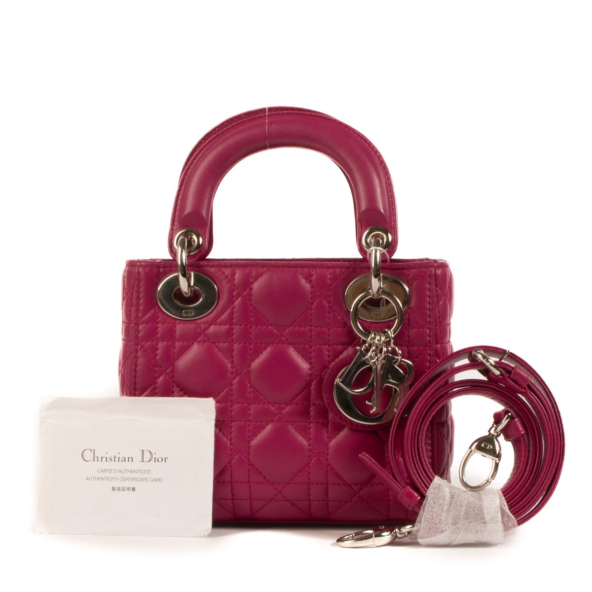 Shop safe online at Labellov in Antwerp, Brussels and Knokke this 100% authentic second hand Christian Dior Fushia Lambskin Mini Lady Dior